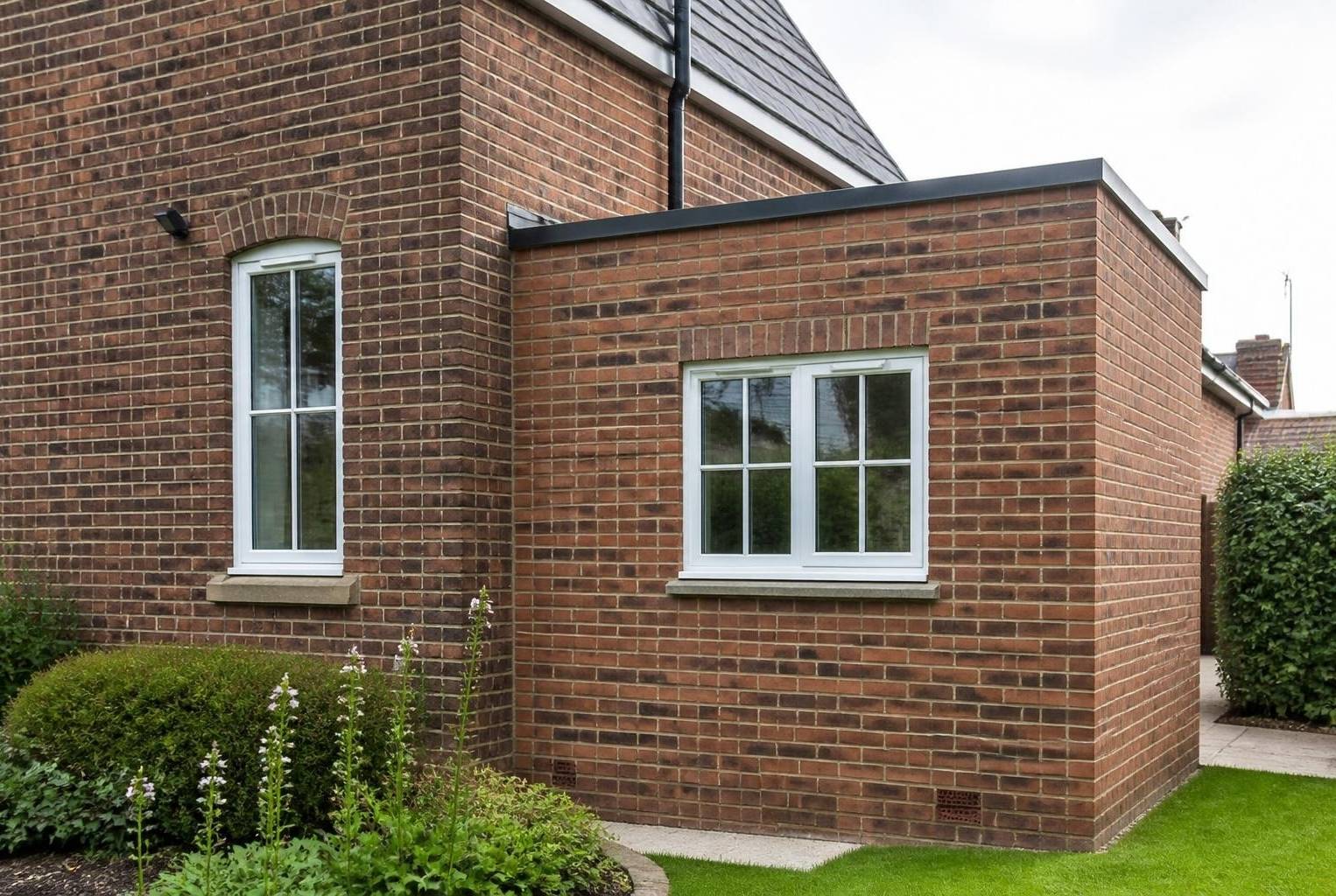 Brick extension colour-matched with brick tint to blend with the original house brickwork.