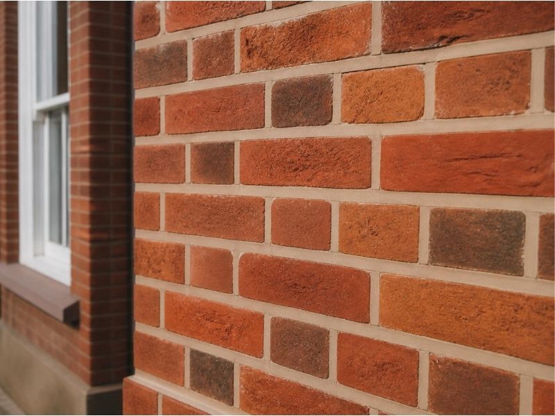 Repointing: Newly repointed red brickwork with even lime mortar joints